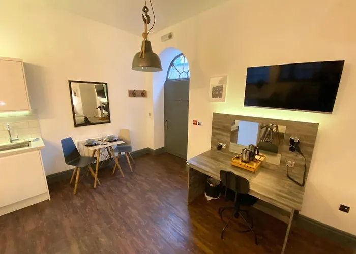 Apartamento At The Coach House